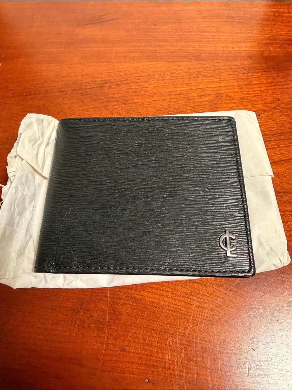 Coach Black Textured Leather Bi-Fold Wallet with Silver Coach Logo